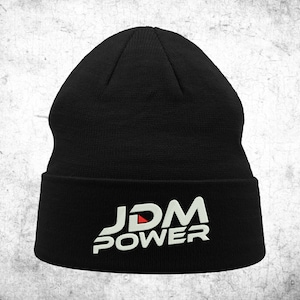May include: Black beanie with a white "JDM POWER" logo with a red triangle in the "D".