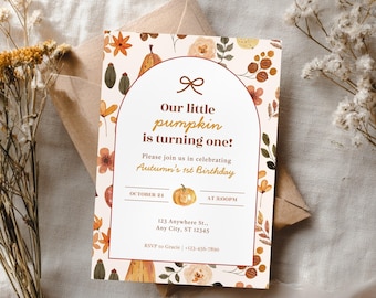 May include: A fall-themed invitation card with the text "Our little pumpkin is turning one!" surrounded by autumn leaves and pumpkins. The card includes details for a first birthday celebration, with a cream background and brown accents.
