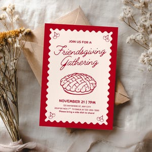 May include: A Friendsgiving Gathering invitation card with a red border and decorative cherries. The invitation features the text "Join us for a Friendsgiving Gathering" and details for the event, including the date, time, and location.