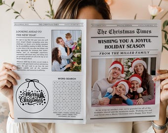 May include: A person holds open a newspaper titled "The Christmas Times" with family photos and holiday greetings. The left page features a Christmas ornament graphic with "Merry Christmas" text. The right page displays a family in Santa hats.