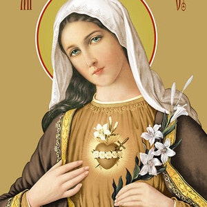 May include: A religious icon depicting the Virgin Mary with a golden halo and a white veil. Her heart is pierced with a sword and surrounded by thorns. She holds a white lily in her right hand. The icon is painted in a traditional style with a gold background.