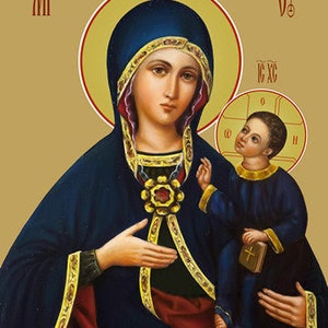 May include: An icon depicting the Virgin Mary holding a young Jesus Christ. Mary is wearing a blue robe with gold trim and a red sash. Jesus is wearing a blue robe with gold trim. The icon is painted in a traditional style with a gold background.