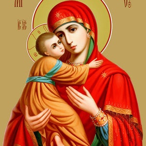 May include: A religious icon depicting the Virgin Mary holding a baby Jesus. The icon is painted in a traditional style with gold accents and features a red and gold background.
