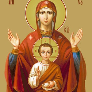 May include: An icon depicting the Virgin Mary and baby Jesus. Mary is wearing a red and blue robe with a gold crown. Jesus is wearing a brown robe and holding a scroll. The icon is painted in a traditional style with gold accents.
