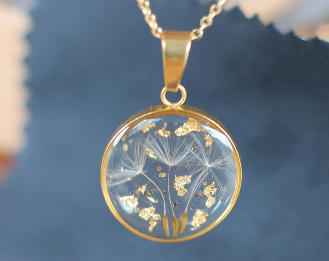 Resin and dandelion pendant, with leaves and gold glitter mounted on a gold-plated chain