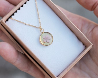 Small dried and pink-tinted flower pendant mounted on an adjustable gold-plated chain, handmade in France