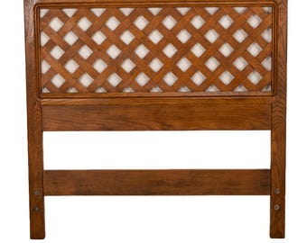 May include: A wooden headboard with a lattice design. The headboard is brown and has a simple, rectangular shape.