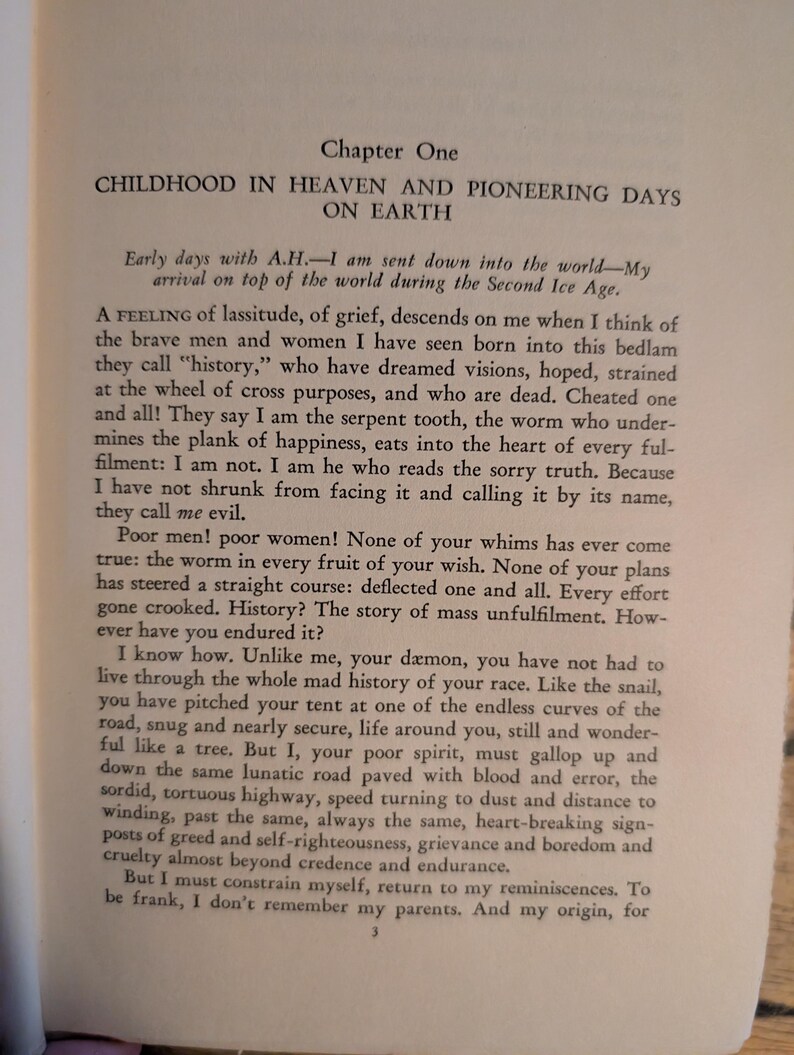 May include: Open book page with text. The title reads "CHILDHOOD IN HEAVEN AND PIONEERING DAYS ON EARTH." The text discusses history, grief, and the human condition. The page is aged with a slightly yellowed tone.