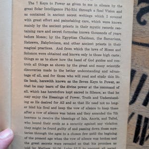 May include: A page from a book titled Introduction, featuring black printed text on an off-white paper background. The text discusses the 7 Keys to Power, referencing ancient priests, Egyptian Chaldean, and various historical figures and scriptures.