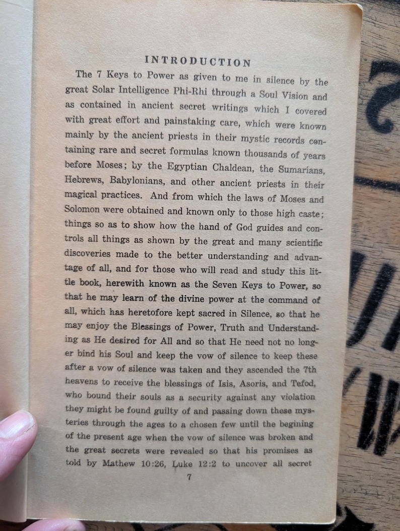 May include: A page from a book titled Introduction, featuring black printed text on an off-white paper background. The text discusses the 7 Keys to Power, referencing ancient priests, Egyptian Chaldean, and various historical figures and scriptures.