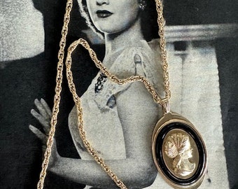 1970s Avon Signed Cameo Pendant Necklace Gold Tone Black Lucite Border Vintage Oval Relief Woman Portrait on Rope Chain Jewelry