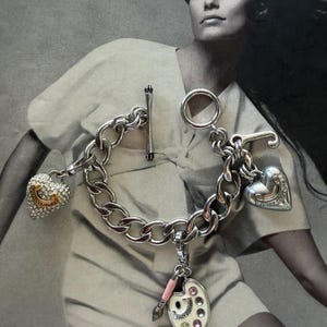 Amazon.com: Juicy Couture Silvertone Heart Charm Toggle  Juicy Couture Chunky Link Toggle Bracelet With Charms Heart Silver Y2k main image 1