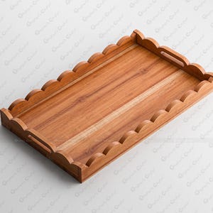May include: A rectangular wooden serving tray featuring a natural light brown wood grain finish. The tray has a scalloped edge border and two integrated cutout handles on the shorter sides, providing a functional and decorative design.