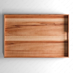 Peut inclure: Un plateau de service rectangulaire en bois présentant un motif de grain naturel avec des bandes horizontales alternées de couleur brun clair et brun moyen. Le plateau possède une base plate et des poignées latérales intégrées.