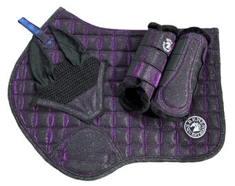 May include: A purple glitter equestrian saddle pad with a quilted pattern, a black mesh ear bonnet, and two matching horse leg boots. The saddle pad features a circular patch with the text Benz Equestrian and a horse head logo in white.