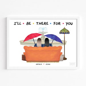 May include: A print featuring the text "I'll Be There For You" in black with colourful dots. Two women are seated on an orange sofa with a fountain behind them. One woman has a red umbrella and the other has a blue umbrella. The print is signed with the names "Natalie" and "Leigh" at the bottom.