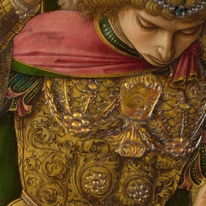 May include: Close-up of a painting depicting a figure wearing gold armor with intricate details. The armor is decorated with floral patterns and a small, gold, human-like face. The figure is wearing a red and green robe.