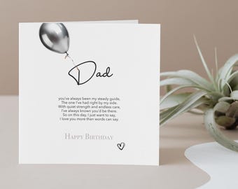 May include: A white greeting card with the word "Dad" in cursive, a silver balloon illustration, and the text "Happy Birthday." The card includes a heartfelt message about love and appreciation.