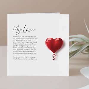 Romantic card titled “My Love,” featuring a large red heart in the center. The design is simple and bold, with a short, heartfelt poem beneath the heart expressing deep affection and devotion. The background is clean, allowing the vivid red heart and touching words to stand out.