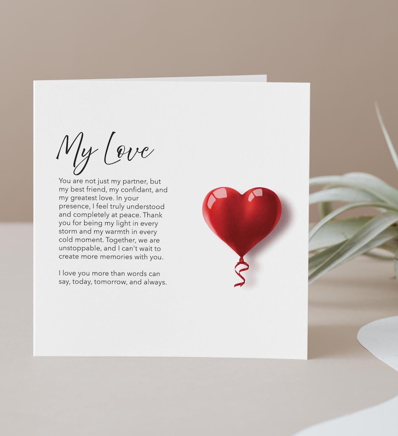 Romantic card titled “My Love,” featuring a large red heart in the center. The design is simple and bold, with a short, heartfelt poem beneath the heart expressing deep affection and devotion. The background is clean, allowing the vivid red heart and touching words to stand out.