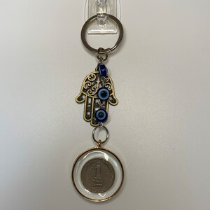 Shekel and hamsa keychain