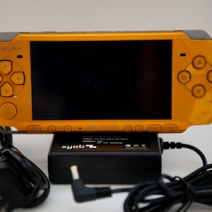 Sony PSP-3000 Bright Yellow - Good Condition - Charger + New Battery