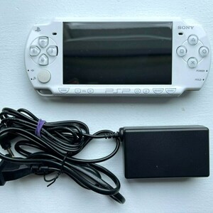 Sony PSP-2000 Console 100% Authentic, WiFi enabled Good Condition Comes with Charger New Battery Tested, Cleaned & Working Ceramic White