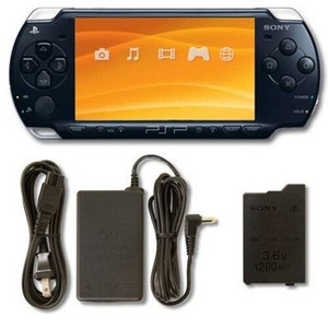 Sony PSP-2000 Console 100% Authentic, WiFi enabled Good Condition Comes with Charger New Battery Tested, Cleaned & Working Piano Black