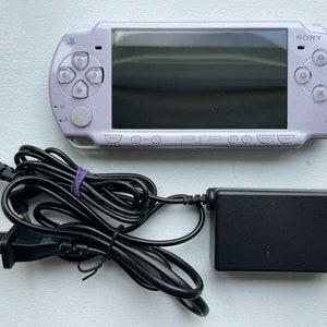 Sony PSP-2000 Console 100% Authentic, WiFi enabled Good Condition Comes with Charger New Battery Tested, Cleaned & Working Lavender Purple