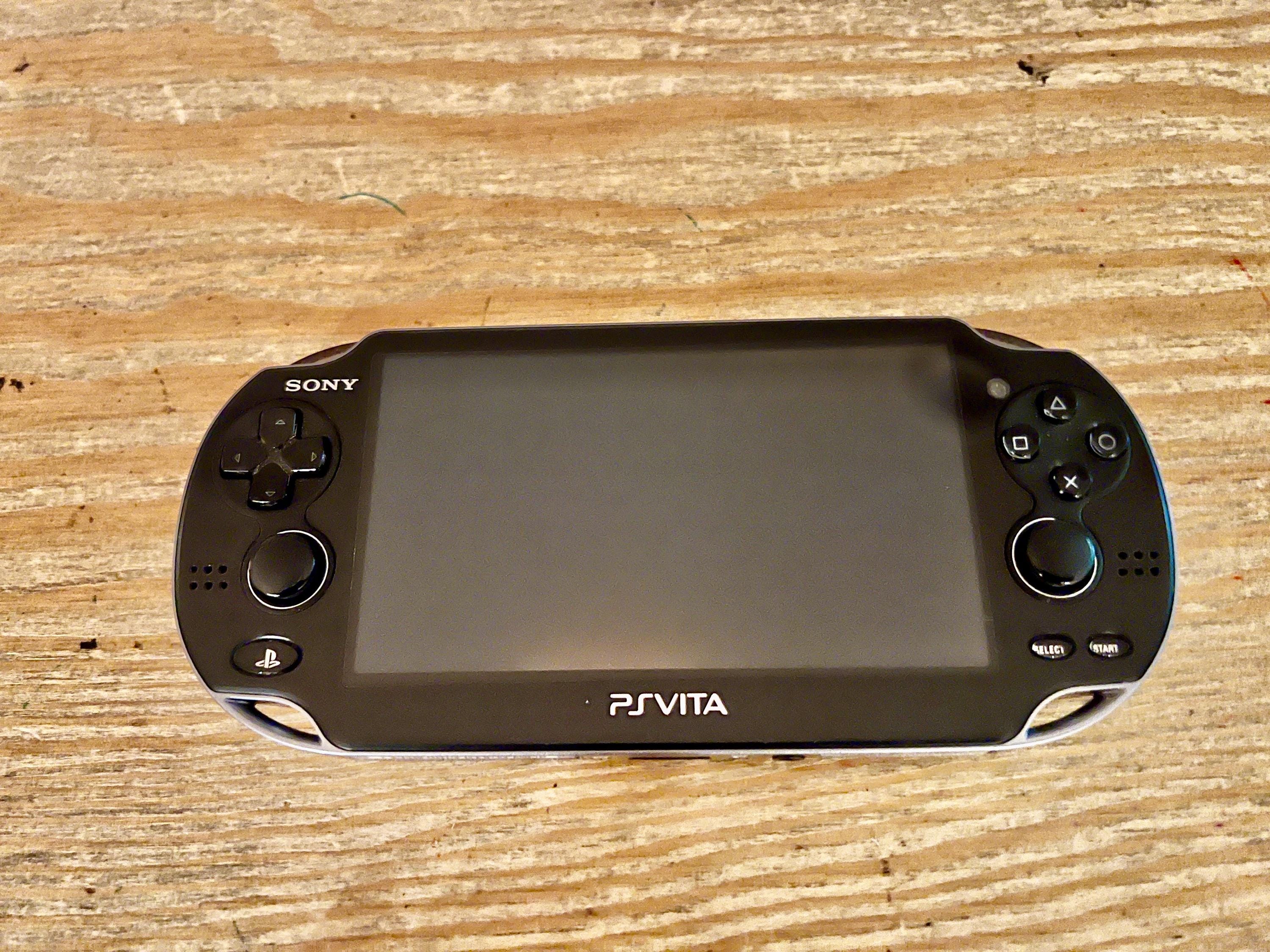 Sony PS Vita 1000 OLED - Black - Good Condition + 8GB Sony Memory