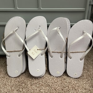 Bulk white flip flops with bags. Sizes small through X-Large. PACK of 24 pairs for listing price. image 2