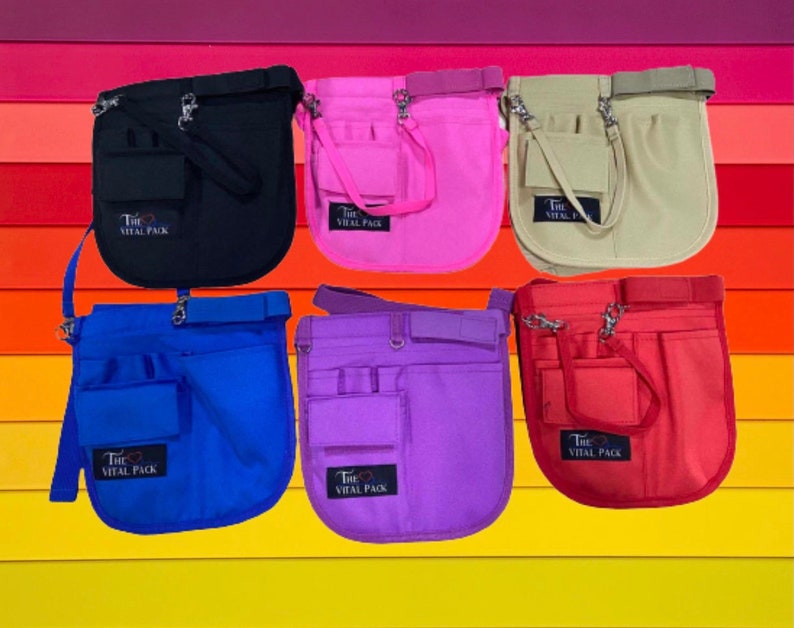 May include: Six different colored utility belts with multiple pockets and a strap. The belts are black, pink, beige, blue, purple, and red. Each belt has the text "The Vital Pack" printed on it.