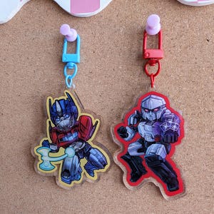 TF One Charms