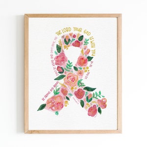 May include: A pink ribbon with floral designs and the text "The Lord your God is with you at all that you do."  Be strong and brave.
