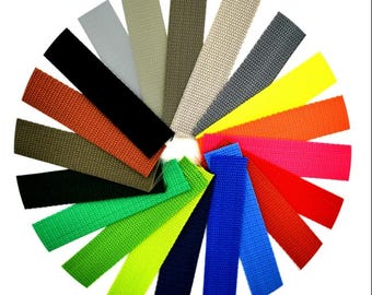 May include: A variety of colors of webbing straps, including black, red, green, blue, yellow, orange, and gray.