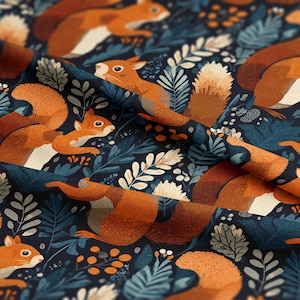 May include: A textile featuring a repeating pattern of orange squirrels set against blue and white foliage on a dark navy backdrop. The squirrels, with their bushy tails, are depicted in various poses, creating a whimsical forest theme.