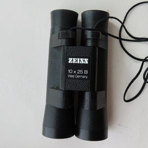 May include: A rustic wooden sign with the text "Welcome to our home" in white lettering. The sign features a distressed finish and a simple, inviting design, perfect for entryway decor.