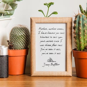 May include: A framed print with a handwritten lyric from the song "Mother, Mother Ocean" by Jimmy Buffett. The lyric reads: "Mother, mother ocean, I have heard you call Wanted to sail upon your waters since I was three feet tall You've seen it all, you've seen it all".