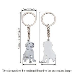 May include: Two silver dog keychains. One keychain features a detailed dog design, the other a silhouette. Each keychain is about 10 cm (4 inches) long, with a ring diameter of 3 cm (1.2 inches). The text says, "The size needs to be confirmed based on the customized image."