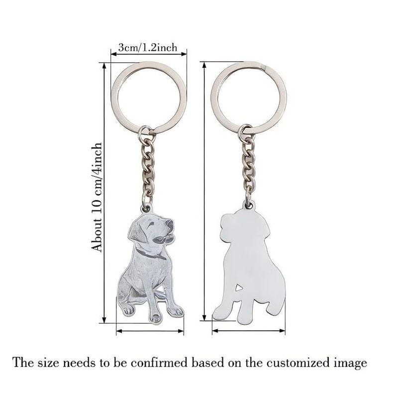 May include: Two silver dog keychains. One keychain features a detailed dog design, the other a silhouette. Each keychain is about 10 cm (4 inches) long, with a ring diameter of 3 cm (1.2 inches). The text says, "The size needs to be confirmed based on the customized image."