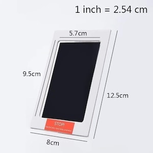 May include: A white rectangular baby handprint and footprint kit. The kit measures 5.7cm x 9.5cm (2.2 x 3.7 inches) and 8cm x 12.5cm (3.1 x 4.9 inches). The kit has a black area for the print and the text "STOP!" on a red label.