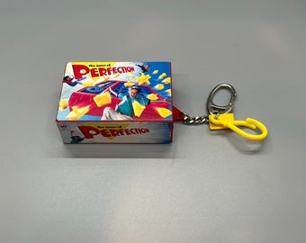 1990s Vintage Board Game PERFECTION pop up game Collectible Key Chain w/ Pieces!