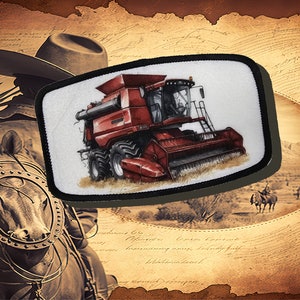 May include: A red combine harvester with a black and white design on a white background. The combine is surrounded by a black border.