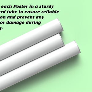 May include: Three white cylindrical cardboard tubes arranged diagonally. Each tube features a smooth, matte white exterior surface with metallic silver-toned end caps. The tubes are positioned parallel to one another against a light green background.