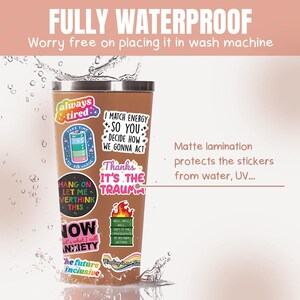 May include: A brown stainless steel tumbler with a variety of colorful stickers. The stickers feature phrases like "always tired", "I match energy so you", "Thanks it's the trauma", and "Now that's what I call anxiety". The tumbler is waterproof and has a matte lamination to protect the stickers from water and UV rays.