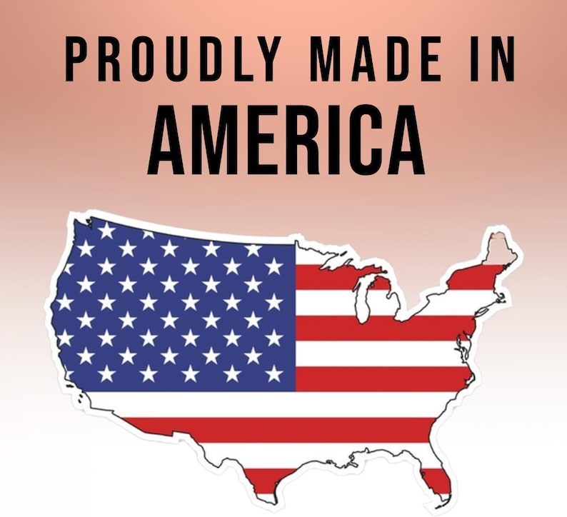 May include: A red, white, and blue American flag in the shape of the United States with the text "Proudly Made in America" above it.