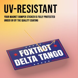 May include: A blue and red magnet bumper sticker with white text that reads "FOXTROT DELTA TANGO" and five stars on each side. The sticker is UV-resistant and protected by a quality coating.