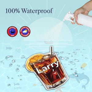 May include: A sticker featuring a glass of iced tea with an orange slice and a straw, with the name Larry printed in white across the glass. The text 100% Waterproof is visible, along with two circular icons labeled Car Wash Safe and Resistant Against All Elements.