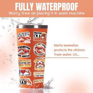 May include: A stainless steel tumbler with a variety of colorful stickers featuring crawfish and humorous sayings. The stickers include "Pretend I'm a Crawfish", "Crawfish Boil Master", "Everybody in the Hot Tub", "Feed a Crawfish", "Suck the Heat Pinch the Tail", and more. The tumbler is submerged in water, demonstrating its waterproof nature.