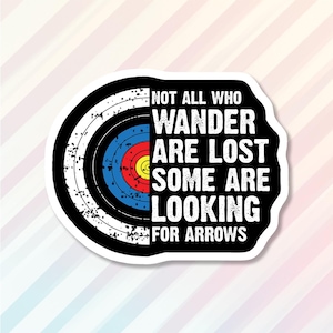 May include: Black and white sticker with a target graphic and the text "Not all who wander are lost some are looking for arrows".